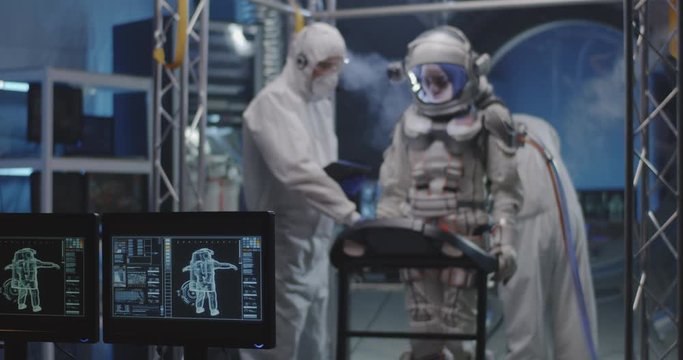 Astronaut walking on a treadmill