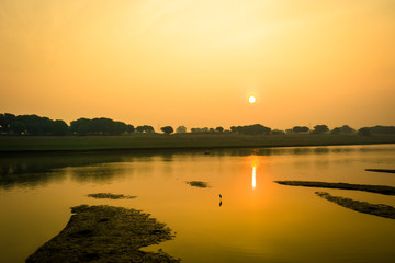 Sunrise at the bank of river during autumn