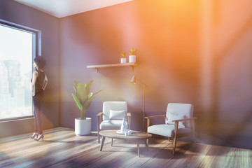 African American woman in gray living room