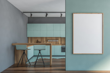 Blue and gray kitchen with bar and poster