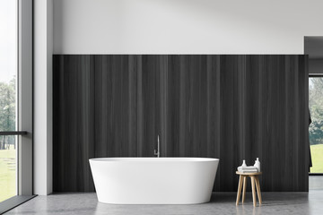 Fototapeta na wymiar Dark wood and white bathroom interior with tub