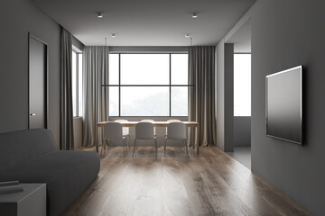 Gray living room with TV and dining table