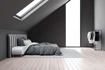 Side view of gray attic bedroom with clothes