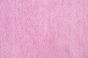 Close up of pink colored wool textile texture abstract background