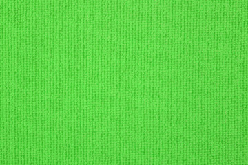 Close up of green colored wool textile texture abstract background