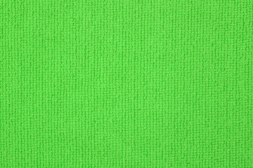 Close up of green colored wool textile texture abstract background