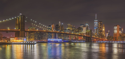 Fototapeta na wymiar Panorama scene of New york Cityscape with Brooklyn Bridge over the east river at the twilight time, USA downtown skyline, Architecture and building with tourist concept