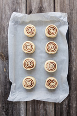 Raw Cinnamon rolls. Preparation process - unbaked dough, waiting before baking 