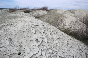 Ukrainian soil.Grungy arid land texture. Grey cracked floor surface. Ecological problem. Near...