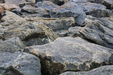 This is a picture of hard rocks near the seashore.