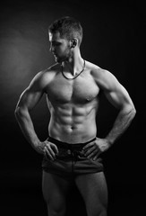 Fototapeta na wymiar Brutal strong bodybuilder athletic fitness man pumping up muscles workout bodybuilding.
