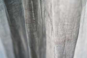 Closeup of linen curtains on a window