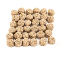 Heap of bran particles isolated on white