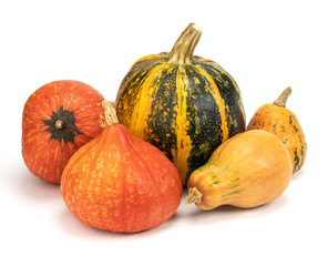 The main attributes of the holiday are Halloween, pumpkin of different sizes on a white background, bright natural color, high contrast.