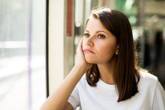 Bored unhappy woman sitting in tram