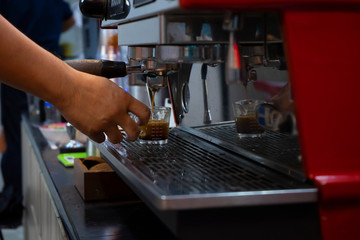 espresso shot in barista making coffee