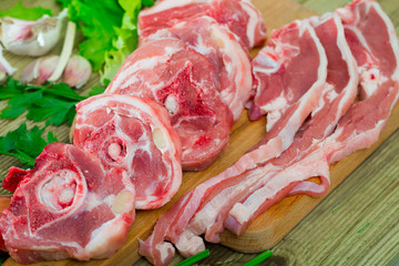 Raw lamb meat with vegetables