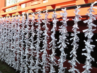 Written oracles hanging on a shrine