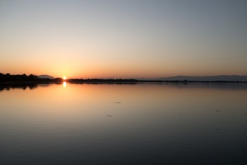 Fototapeta na wymiar sunset over the ptujsko jezero dam on drava river in Ptuj in Slovenia
