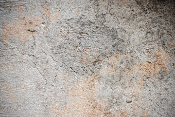 Dark plaster wall with dirty cracked scratched background. Old retro vintage brickwall with peel grey stucco texture