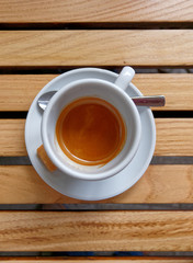 hot Italian espresso coffee on wooden table background
