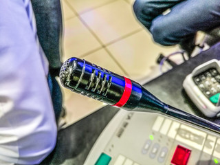 closeup of a black digital announcement mike at a conference hall 