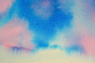 Watercolor background. Stains and flow of flowers. A mixture of blue, cyan and pink.