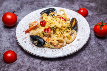 noodles with seafood in a white plate