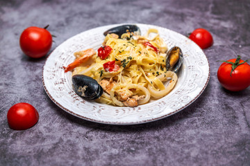 noodles with seafood in a white plate