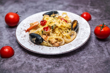 noodles with seafood in a white plate