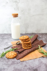 oatmeal cookies with milk on the table
