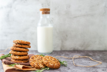oatmeal cookies with milk on the table