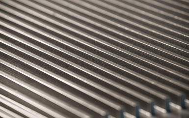 Fluted metal surface next to a control panel
