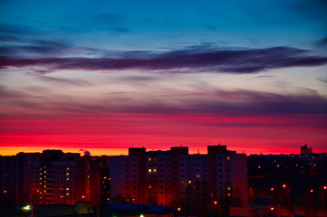The concept of the night sky over the city. Photo of a colorful dark sky at sunrise. - 305179902