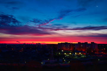 The concept of the night sky over the city. Photo of a colorful dark sky at sunrise.