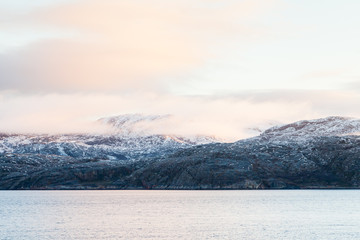 A Winter View Of The Rocky Coastline Close To The Norwegian Town Of Kirkenes