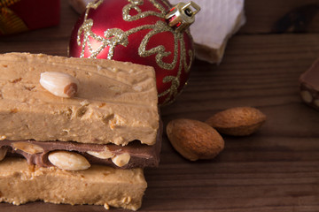 nougat, typical Christmas dessert on wooden background