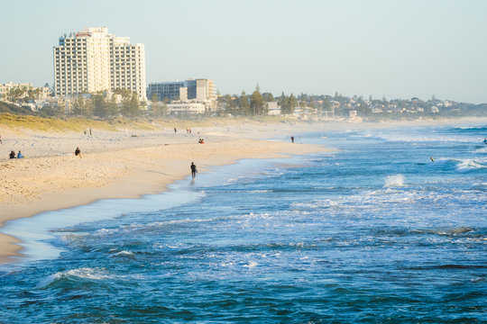Beautiful views at golden hour of the sunset over the beach and ocean with people out to enjoy the summer lifestyle Trigg, Perth, Western Australia has to offer.