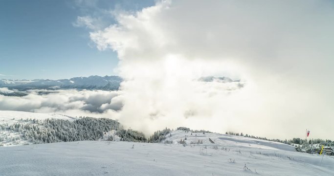 4K Timelapse view of a forest covered with fresh snow and clouds in the Aletsch Arena area. Switzerland in the fall