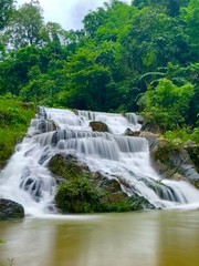 Obraz premium Beautiful rain forest waterfall in Uttaradit, Thailand