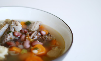 Red kidney bean soup on white background. Indonesian food. 