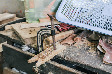carpenter working with a wood product, hand tools, close up cutting wooden boards. Construction details of male worker or handy man with power tools
