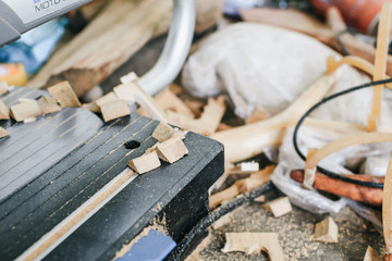 carpenter working with a wood product, hand tools, close up cutting wooden boards. Construction details of male worker or handy man with power tools