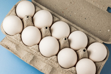 White chicken eggs in a cardboard box