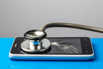 Mobile phone and stethoscope, repair concept