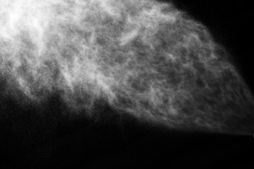 A stream of water and a cloud of drops