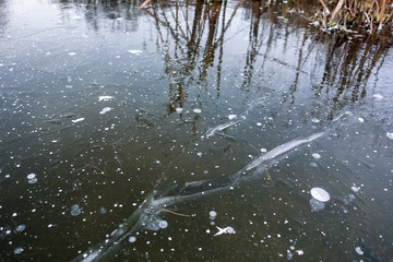 Frozen lake Air bubbles frozen in the ice of the lake. Beautiful winter background