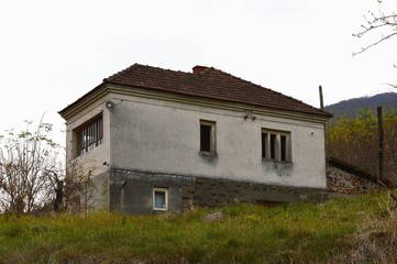 Fototapeta na wymiar an old ruined, abandoned village house