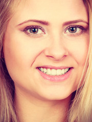 Closeup portrait of happy attractive blonde woman