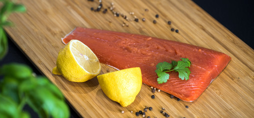 Fillet of salmon. Fresh and beautiful salmon fillet on a wooden table. 